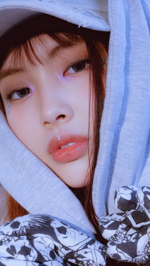 Hyein from NewJeans with glitter makeup