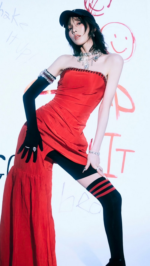 Taeyeon in a red dress with black gloves and stockings