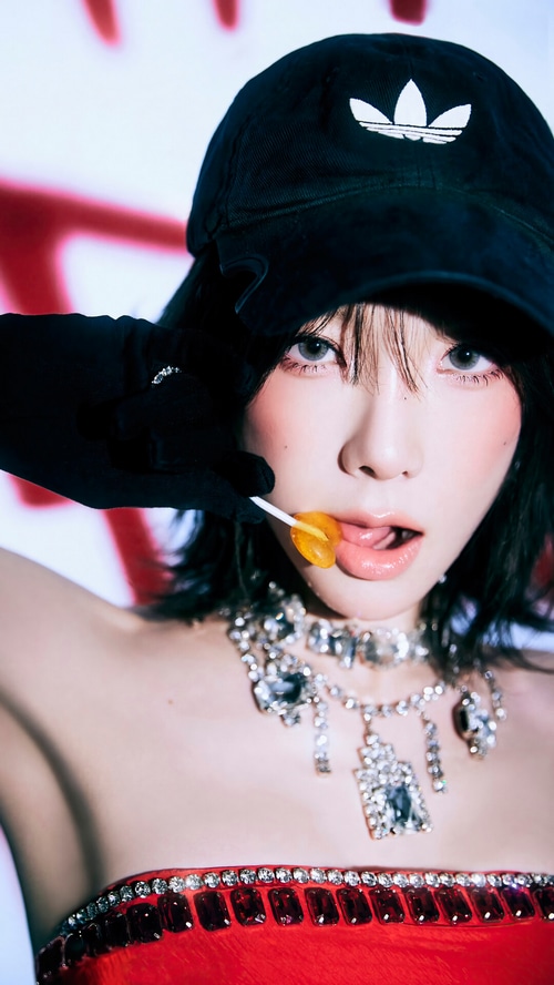 Taeyeon with lollipop and Adidas cap