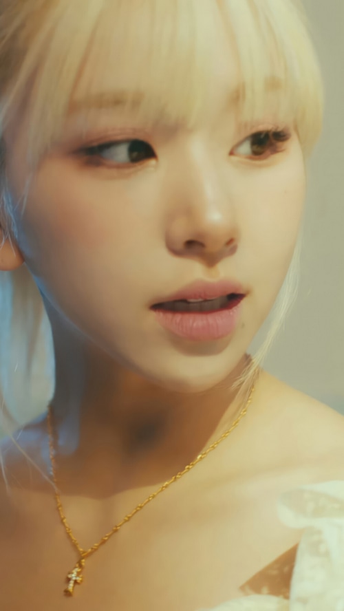 TWICE Chaeyoung wearing a gold necklace with a cross pendant