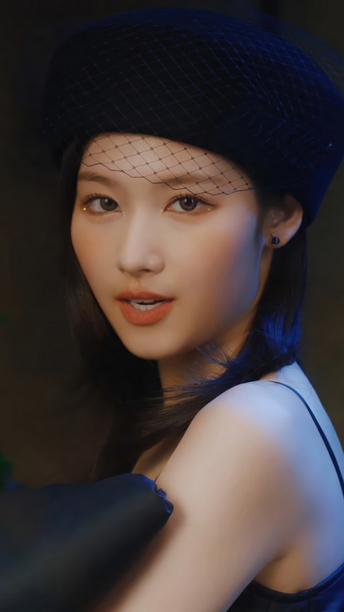 Sana of TWICE wearing a black beret with veil