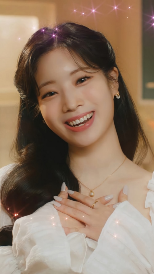Dahyun of TWICE smiling with hands on chest