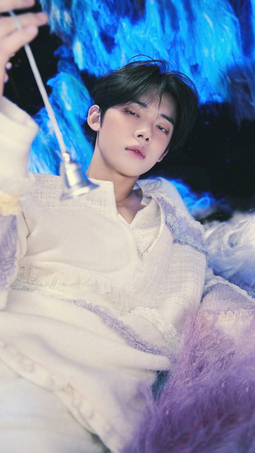 Yeonjun of TXT holding a bell