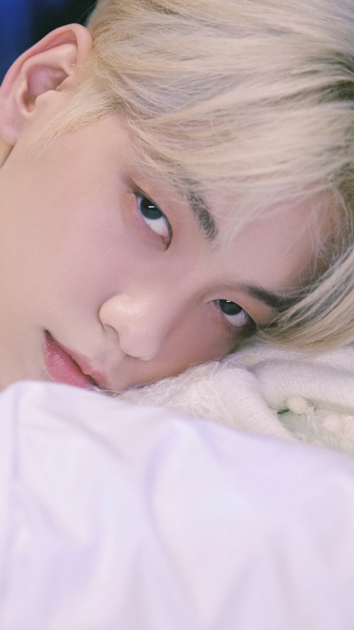 Soobin from TXT lying down