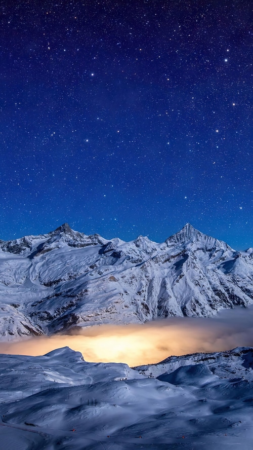 Snowy Mountains Under a Starry Night Sky 4K
