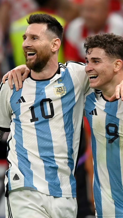 Lionel Messi and Julian Alvarez celebrate