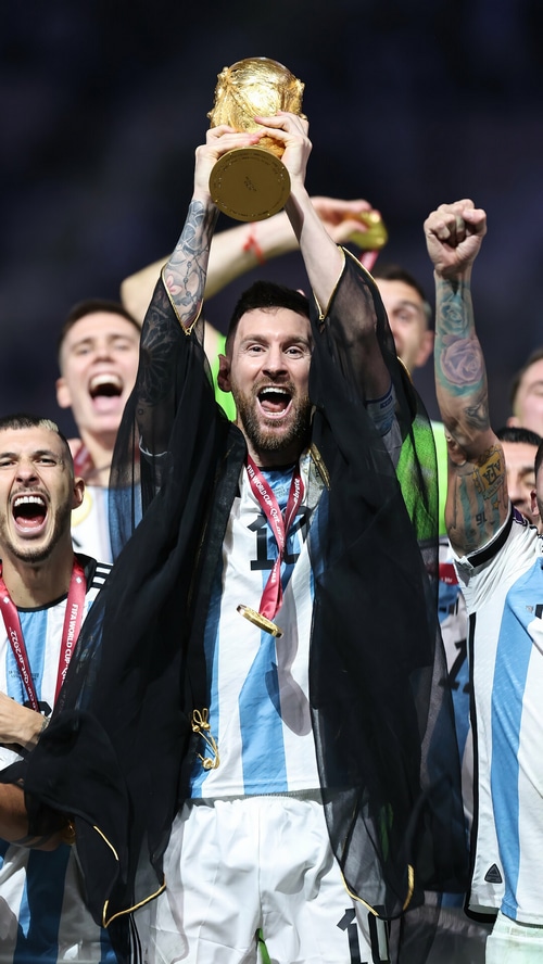 Lionel Messi lifts the FIFA World Cup trophy