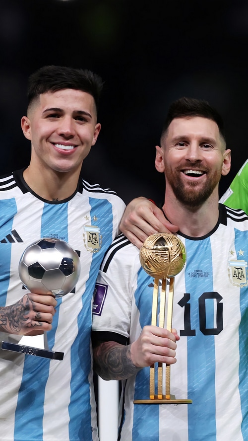 Lionel Messi and Enzo Fernandez with FIFA World Cup Trophy