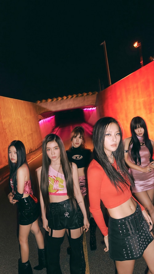 Red Velvet members posing in a tunnel at night