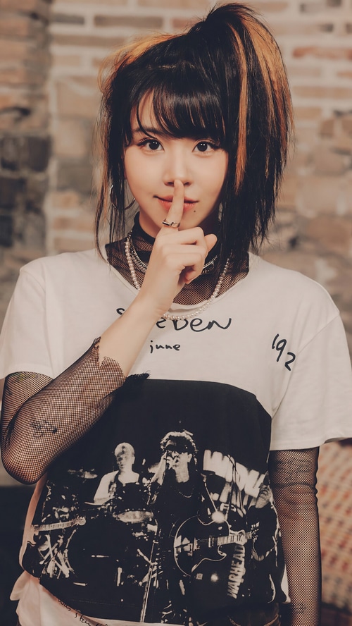 Chaeyoung from TWICE with a shushing gesture