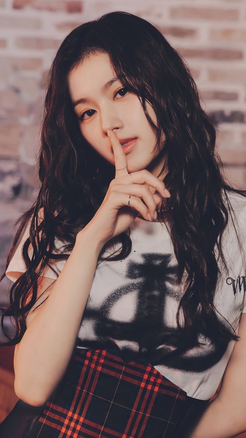 Sana of TWICE posing with finger to lips