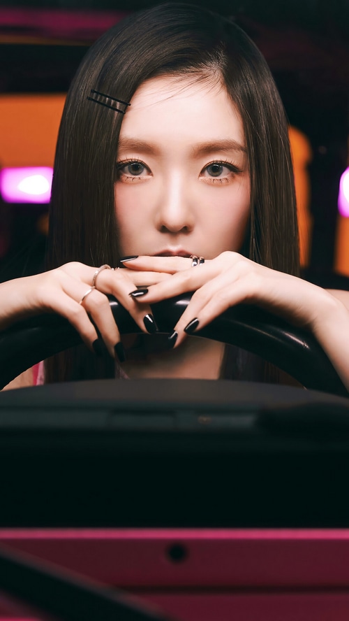 Irene of Red Velvet holding a steering wheel