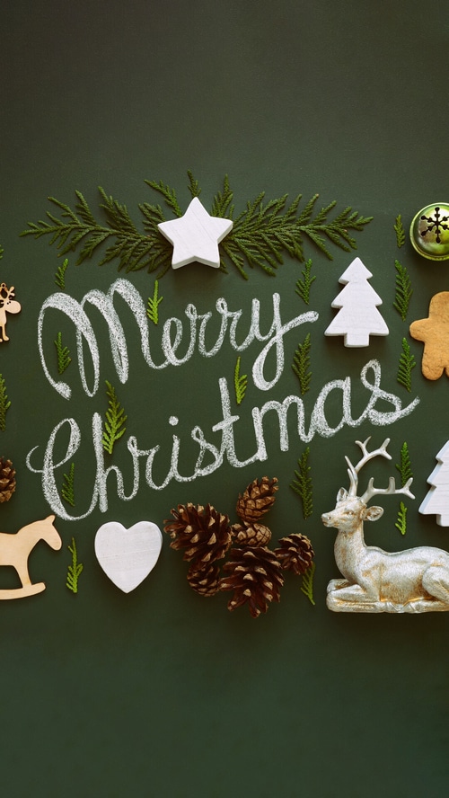 Merry Christmas chalkboard art with festive decorations