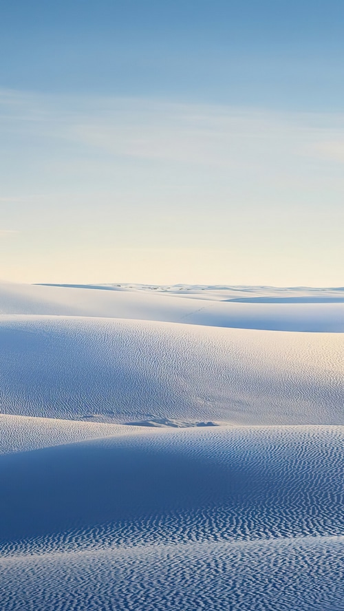 White Sand Dunes Under a Blue Sky