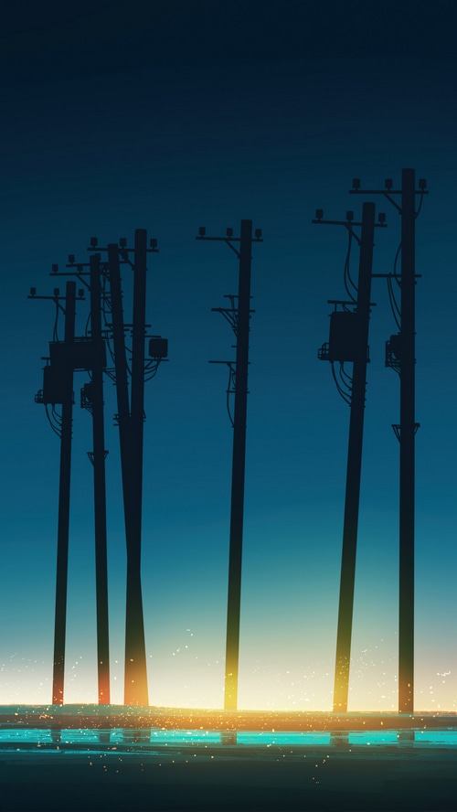 Utility poles silhouetted against a sunrise sky