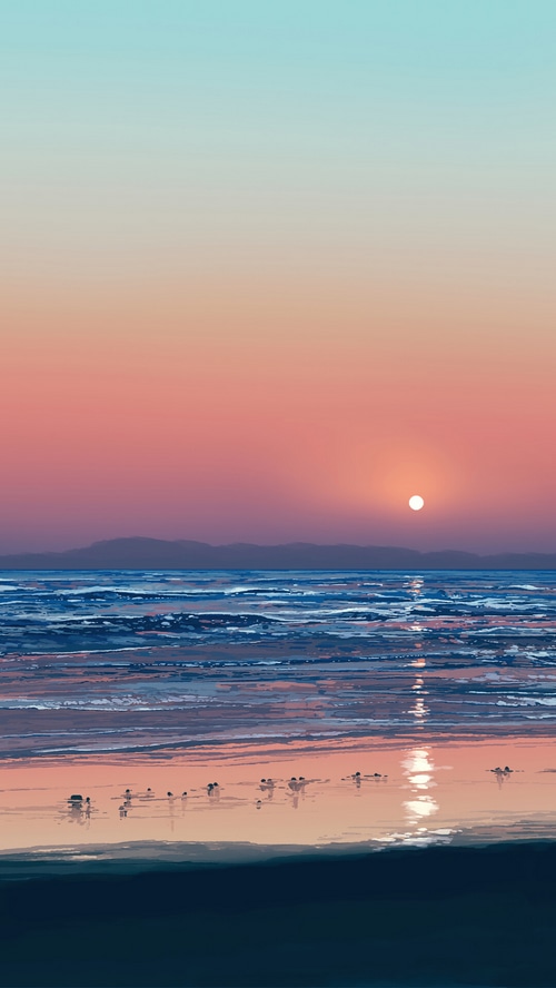 Beach Sunrise with Distant Mountains and Ocean Waves