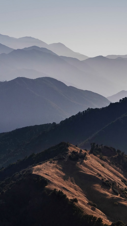 Layered mountains fading into the sky
