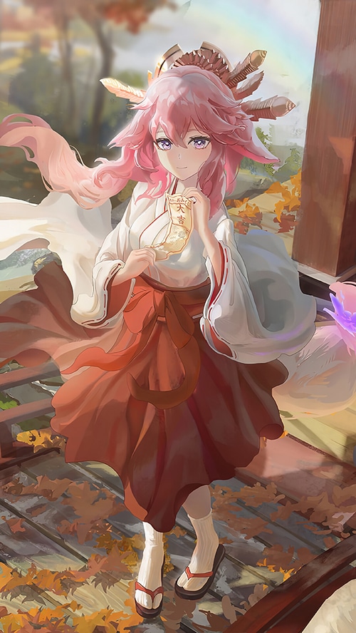 Yae Miko from Genshin Impact holding a charm