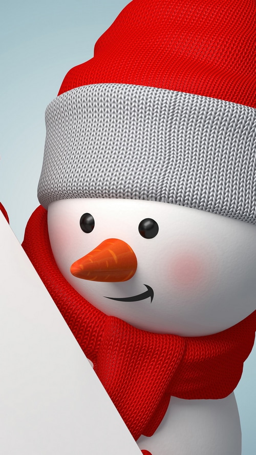 Snowman wearing a red hat and scarf