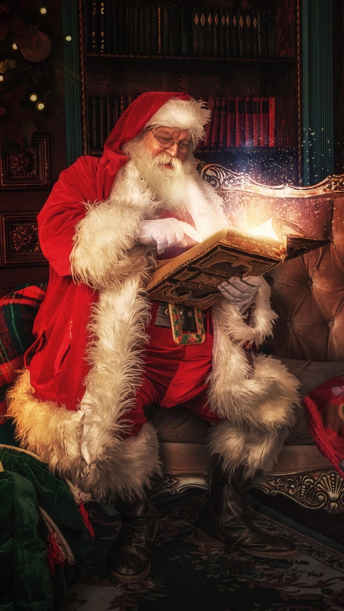 Santa Claus reading a magical book