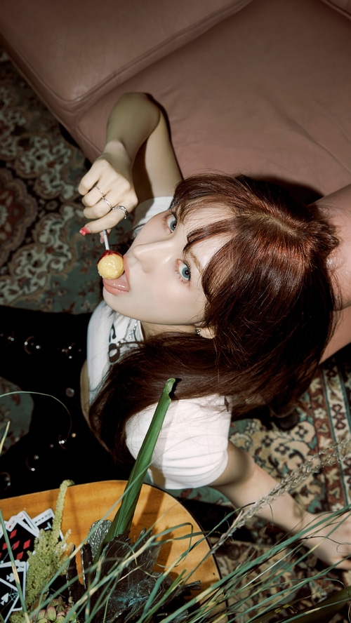 Wendy of Red Velvet eating a lollipop