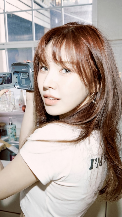 Wendy from Red Velvet holding a camcorder