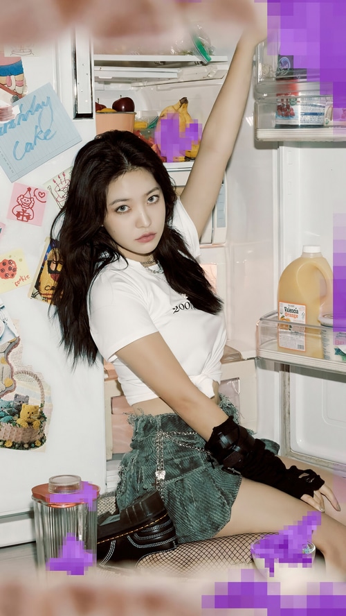 Yeri poses in front of an open refrigerator
