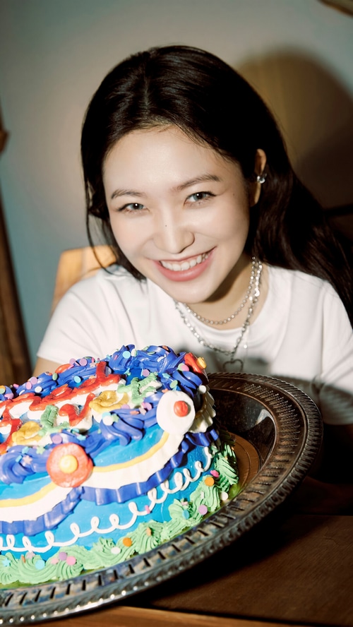 Yeri of Red Velvet with a colorful birthday cake
