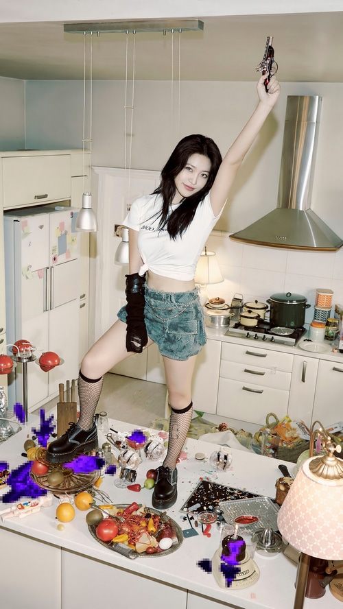Yeri from Red Velvet holds a toy gun in a messy kitchen