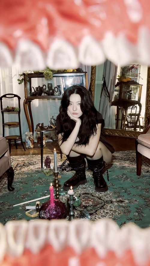 Seulgi of Red Velvet in a dark, surreal room