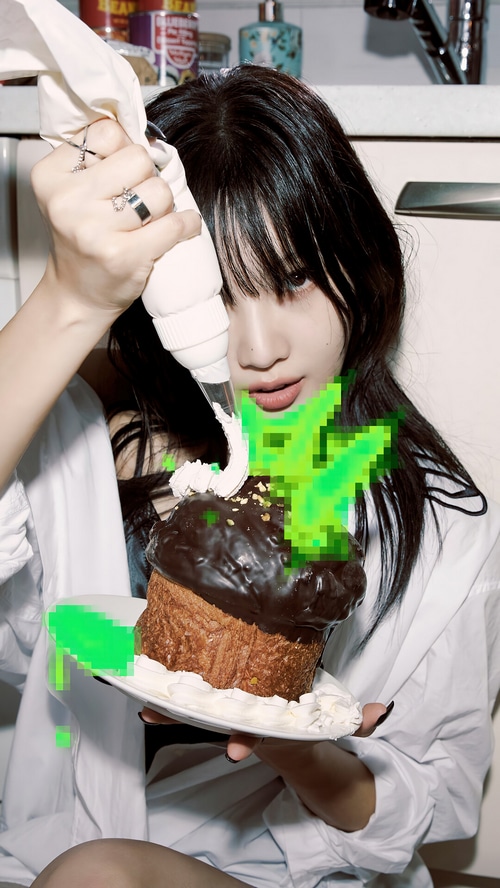 Joy decorating a chocolate cake with frosting