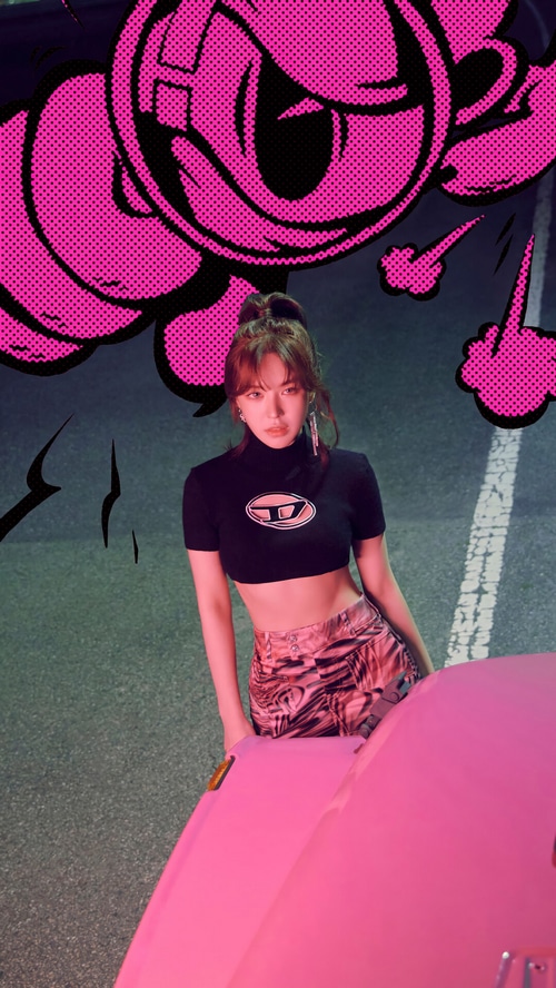 Wendy in a black crop top and patterned skirt