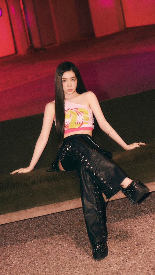 Irene of Red Velvet sits on a couch