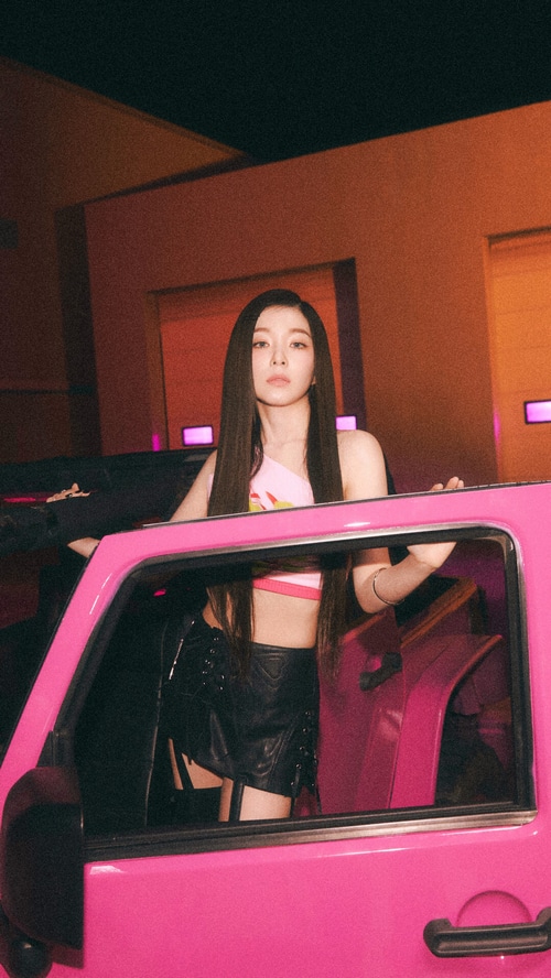 Irene of Red Velvet posing by a pink car