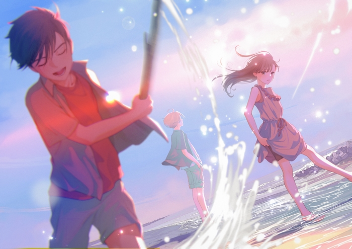 Children playing on the beach at sunset
