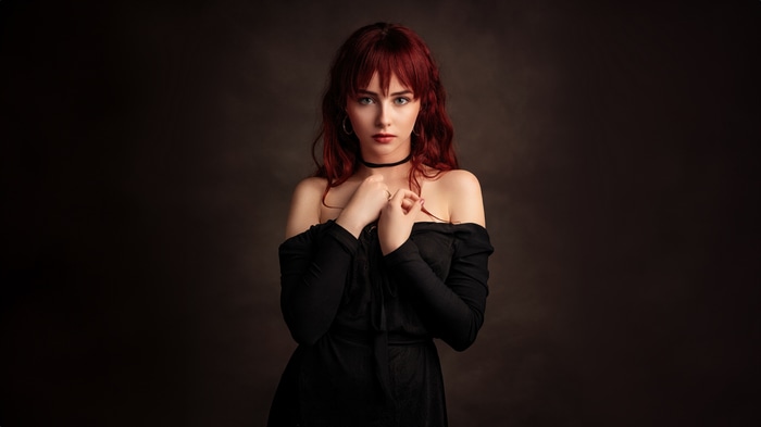 Redhead model in black dress