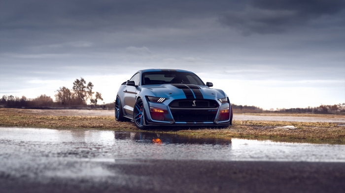 Blue Ford Mustang Shelby GT500 on Wet Ground