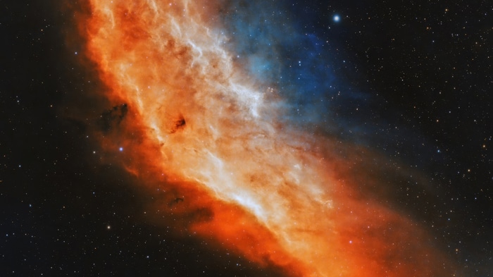 Cosmos digital art with orange and blue nebula