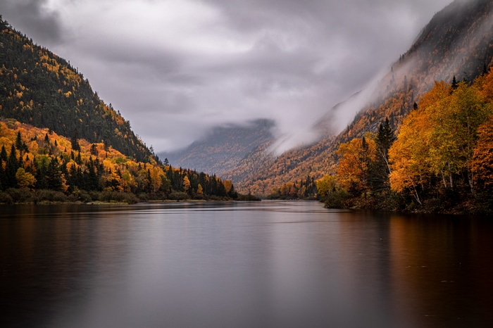 Autumn foliage in a mountain valley with a lake