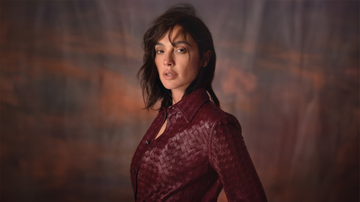 Gal Gadot in a burgundy woven jacket