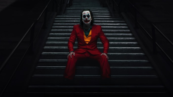 Joker sitting on stairs