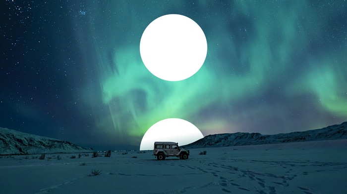 Jeep under Aurora Borealis
