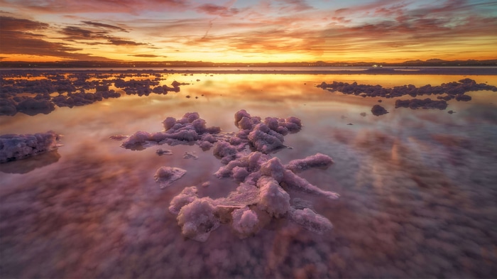 Salt formations in a lake at sunset in Spain