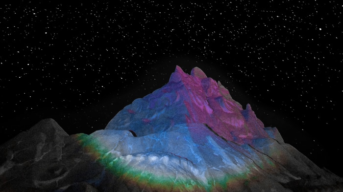 Mountain peak under a starry sky