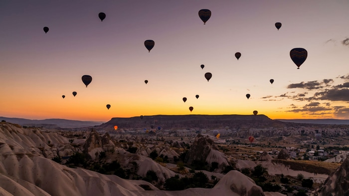 Hot air balloons over Cappadocia at sunrise