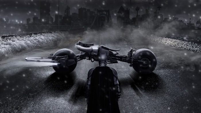 Batman on Batcycle in a snowy city