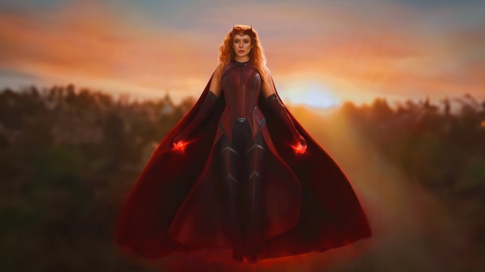 Scarlet Witch with red energy at sunset