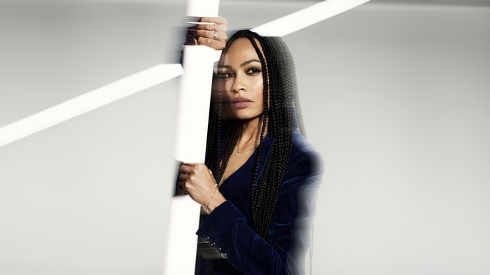 Rosario Dawson in a blue velvet jacket