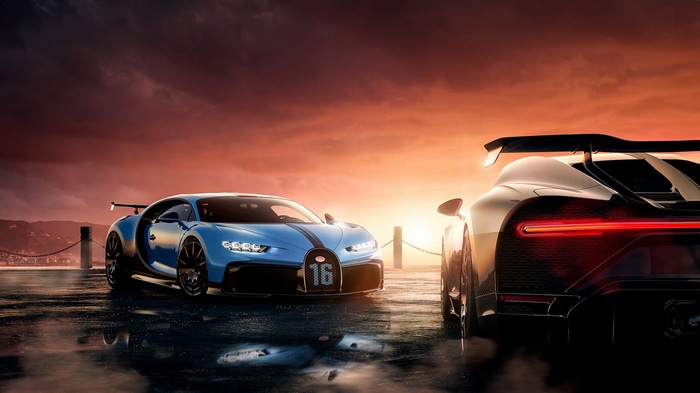 Bugatti Chiron cars on wet surface at sunset