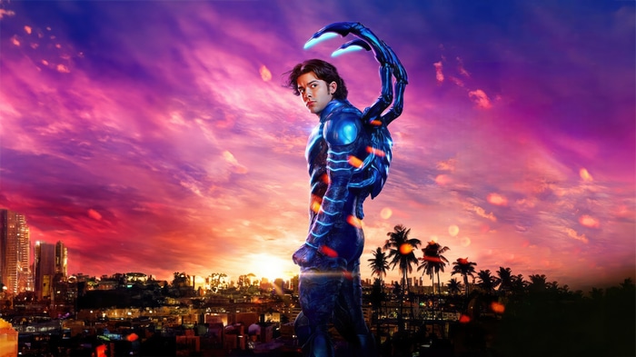 Blue Beetle in a city at sunset